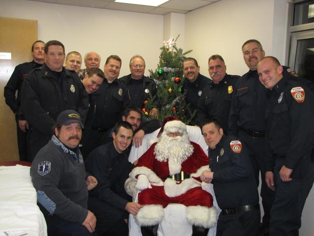 November 30, 2012: Members of the Westmont Fire Company with Santa after the Annual Township Parade of Lights.