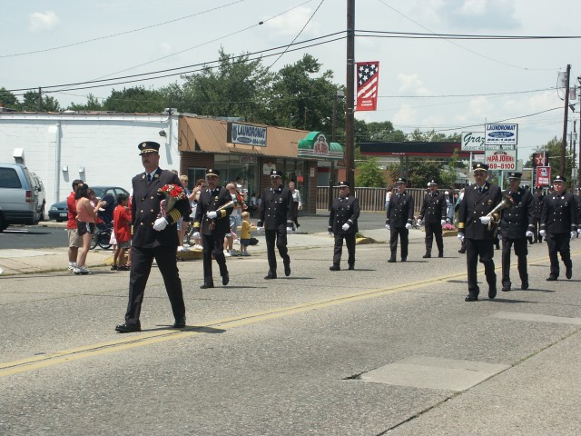 Chief Preston G. Morgan, Jr. and Assistant Chiefs John Medes and Rick Etter lead the members of the Westmont Fire Company up Haddon Avenue during the 100th Anniversary Parade.